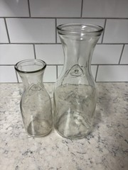 Set of two clear glass Paul Mason carafes with « Since 1852 » embossed marking.