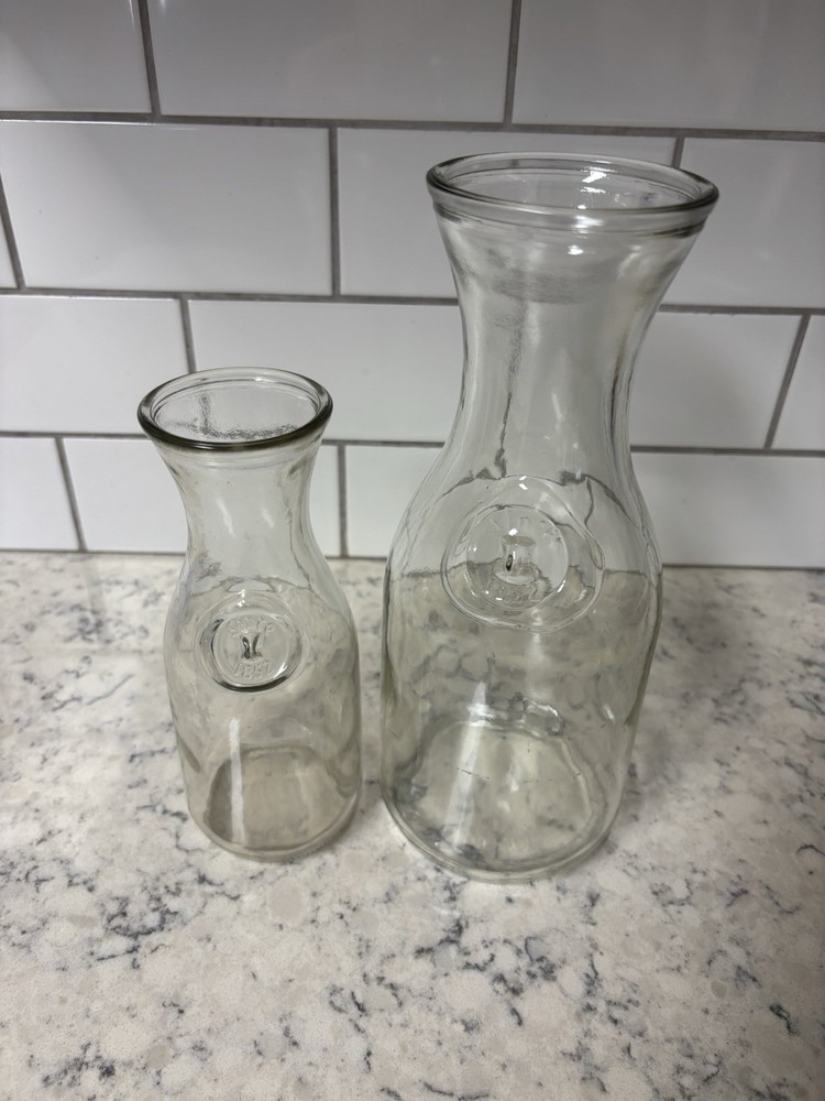 Set of two clear glass Paul Mason carafes with « Since 1852 » embossed marking.