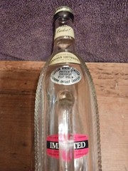 Vintage LONDON WINERY LTD Empty Clear Horizontal Bottle in Basket/Ship w/Handle