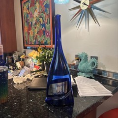 Empty Colbalt blue Incanto Wine bottle