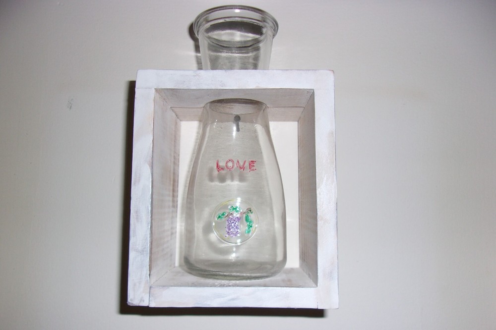 LOVE WINE BOTTLE IN ANTIQUE WHITE BOX. 8 BY 5 BY 4 INCHES.