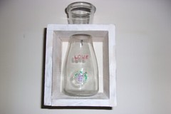 LOVE WINE BOTTLE IN ANTIQUE WHITE BOX. 8 BY 5 BY 4 INCHES.