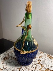 1963 Chianti Italian Wine Green Glass Decanter & Blue Wicker Basket w/labels.
