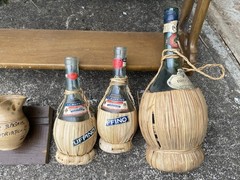Splendid vintage collection of empty Italian Chianti flascas and ceramic jags