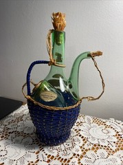1963 Chianti Italian Wine Green Glass Decanter & Blue Wicker Basket w/labels.