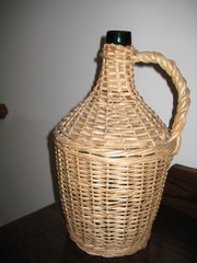 Large vintage 15 1/2&Prime; by 10&Prime; woven rattan wicker covered demijohn wine jug