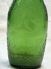 Vgt Green Glass Wine Bottle With Embossed Grape Designs, 11” Tall