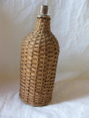 BOTTLE WITH HANDWOVEN WICKER WRAP. DEMIJOHN, 10&Prime;