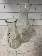 Set of two clear glass Paul Mason carafes with « Since 1852 » embossed marking.