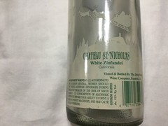 Christmas themed empty Chateau St. Nicholas wine bottle
