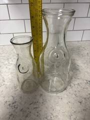 Set of two clear glass Paul Mason carafes with « Since 1852 » embossed marking.
