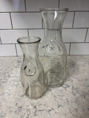 Set of two clear glass Paul Mason carafes with « Since 1852 » embossed marking.