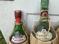 Splendid vintage collection of empty Italian Chianti flascas and ceramic jags