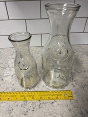 Set of two clear glass Paul Mason carafes with « Since 1852 » embossed marking.
