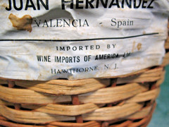 JUAN HERNANDEZ SPANISH BURGUNDY WICKER ENCASED 1 GAL BOTTLE VINT. 1959