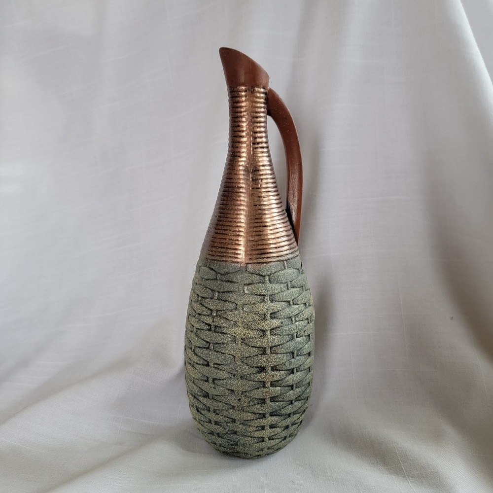 Empty wine bottle in the style of ancient Greece with a basket weave texture and