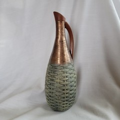 Empty wine bottle in the style of ancient Greece with a basket weave texture and