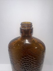 Vintage 1930&rsquo;s Brown Embossed Grape & Leaf & Vine One Pint Wine Bottle Wine Oval