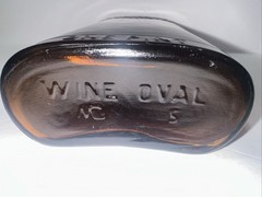 Vintage 1930&rsquo;s Brown Embossed Grape & Leaf & Vine One Pint Wine Bottle Wine Oval