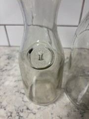 Set of two clear glass Paul Mason carafes with « Since 1852 » embossed marking.