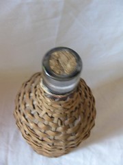BOTTLE WITH HANDWOVEN WICKER WRAP. DEMIJOHN, 10&Prime;