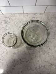 Set of two clear glass Paul Mason carafes with « Since 1852 » embossed marking.