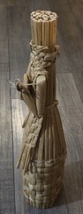 Vintage Wine Bottle Cover Wicker 18” Tiki Statue Playing Instrument