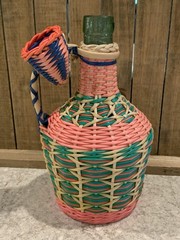 Vintage Green Viresa Glass Bottle Wrapped In Colorful Plastic Wicker 9.5” Tall