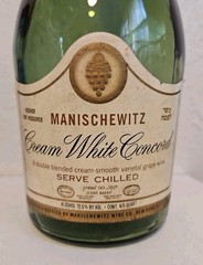 MANISCHEWITZ Cream White Concord grape wine, 4/5 quart bottle(empty). NY Kosher