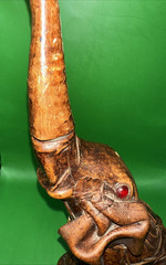VINTAGE LEATHER WRAPPED ELEPHANT WINE BOTTLE WITH RED EYES AND GOLD CHAIN