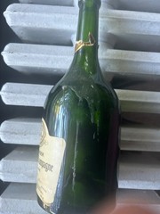 Empty bottle of 1993 Taittinger Comtes de Champagne Millésime Blanc de Blancs