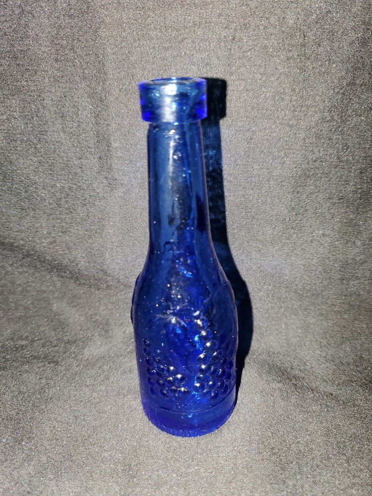 Vintage AM Blue Glass Wine Bottle 5&Prime; Tall Embossed Grapes