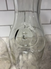 Set of two clear glass Paul Mason carafes with « Since 1852 » embossed marking.
