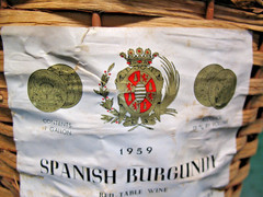 JUAN HERNANDEZ SPANISH BURGUNDY WICKER ENCASED 1 GAL BOTTLE VINT. 1959