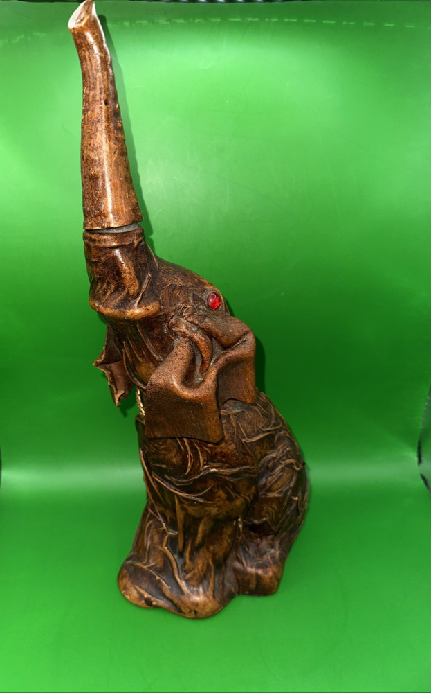 VINTAGE LEATHER WRAPPED ELEPHANT WINE BOTTLE WITH RED EYES AND GOLD CHAIN