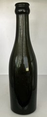 Antique 8 1/4 inch Dark Olive/Green Glass Bottle. O on Bottom. Small chip