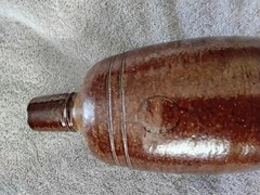 VINTAGE BROWN STONEWARE BOTTLE,PRODUCED IN PORTUGAL BY MAREIA FONSECA PORT WINE,