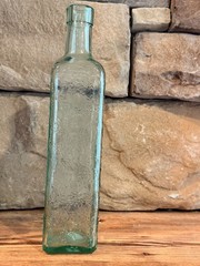 Vintage Tall Bottle. Antique green intricate bottle CANADA