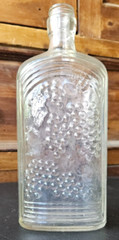WINE 372, KNOX GLASS CO. ONE PINT FLASK. . EMBOSSED GRAPES, K IN KEYSTONE MARK