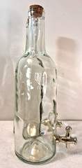 Large Clear Glass Bottle with Cork Stopper And Gold Faucet Used