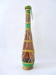 Vtg MCM Tall Brown EMPTY Wine Bottle Wicker Cover Metal Handle Wood Base Stopper
