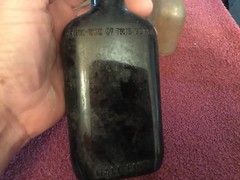 Old Brown 1/2 Pint Bottle and 7 Miniture Bottles