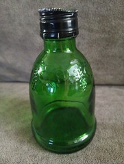 WIne World Vintage Small Green Glass Bottle 1976 embossed grapes screw top cap