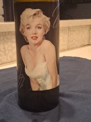 Marilyn Monroe Merlot wine bottle, adorned with beaded bottle cover.