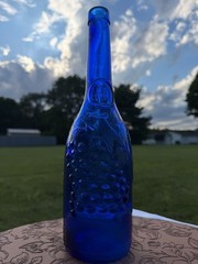 Vintage AM Cobalt Blue Glass Wine Bottle with Embossed Grapes and Leaves