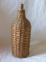 BOTTLE WITH HANDWOVEN WICKER WRAP. DEMIJOHN, 10&Prime;
