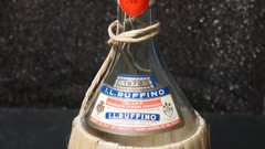 I.L. RUFFINO 1970 VTG WINE BOTTLE EMPTY WITH RATTAN WRAP AND CORK CAP