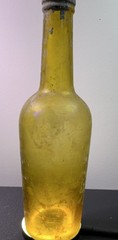 Antique *YELLOW* iridescent glass wine bottle, long neck, 12 oz.