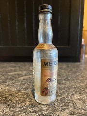 Meier’s Mini 3 Oz Wine Bottle Ohio Sauterne With Paper Label And Embossed Grapes