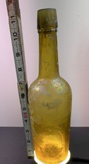 Antique *YELLOW* iridescent glass wine bottle, long neck, 12 oz.